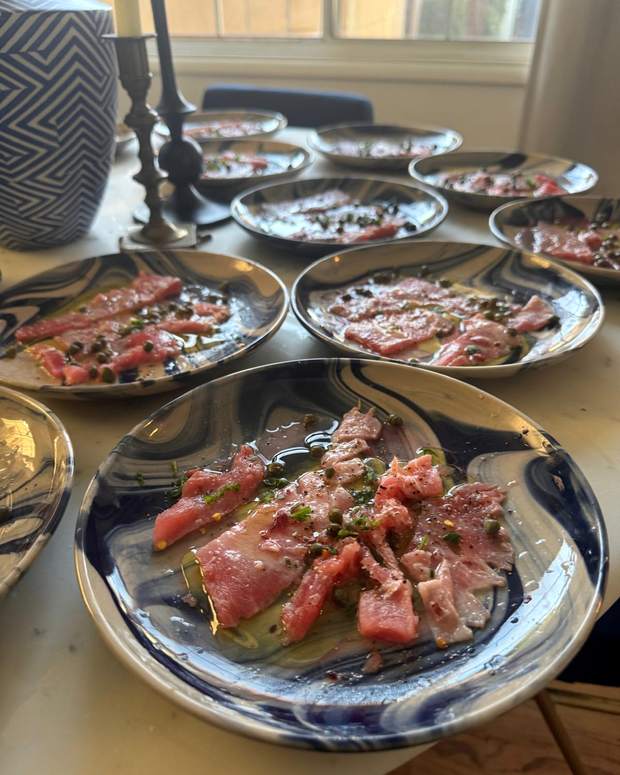 Tuna crudo plated on marbled blue ceramic